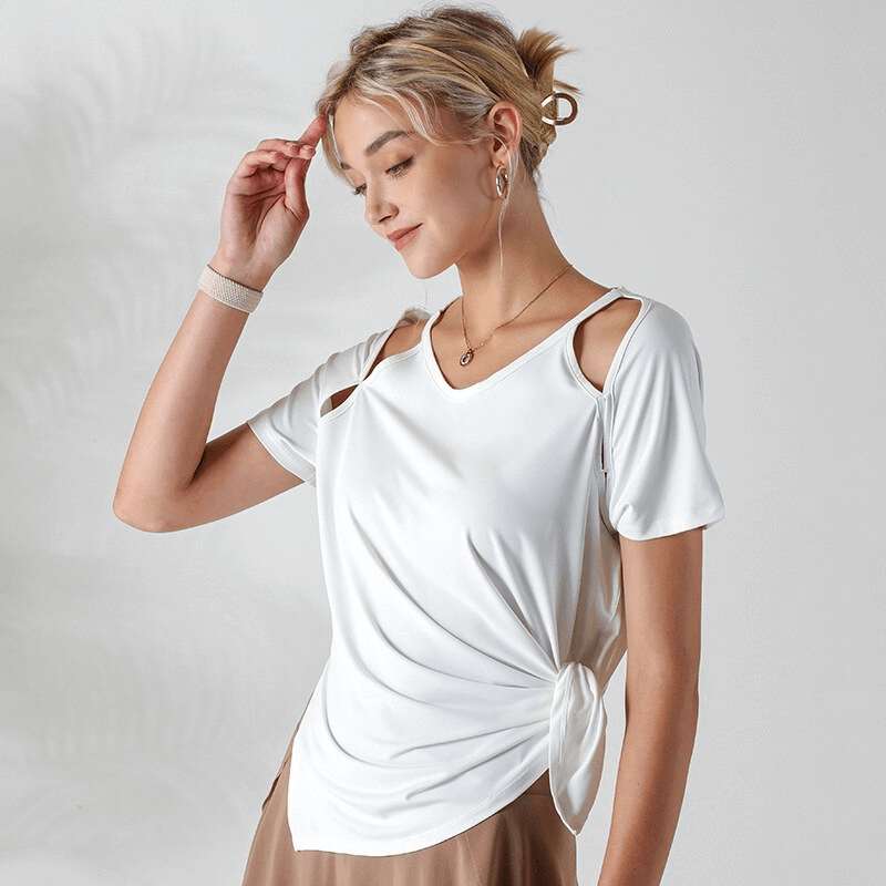 Woman wearing a white loose t-shirt with hollow-out shoulders, perfect for running or yoga. SF1289 sporty chic top.